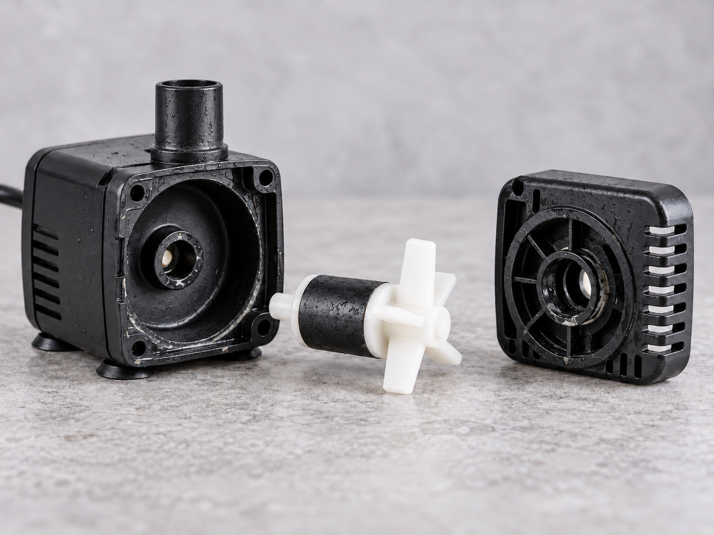 Mineral buildup inside a traditional submerged pet fountain pump